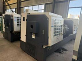 Two Yunnan CY6150L-2000 quasi-new CNC lathes are for sale, with a main shaft hole of 105